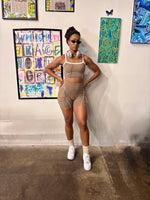 Load image into Gallery viewer, A woman posing in a beige athletic crop top and matching shorts set,
