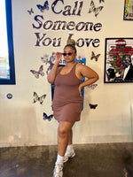 Load image into Gallery viewer, A woman modeling a sleeveless,  active dress in a java brown color
