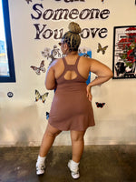 Load image into Gallery viewer, A woman posing from behind wearing a brown active mini dress with a back cutout, 
