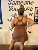 Load image into Gallery viewer, A woman wearing a brown sleeveless active dress with a keyhole racerback, 
