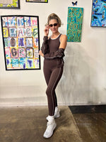 Load image into Gallery viewer, A woman modeling a dark brown activewear jumpsuit and jacket
